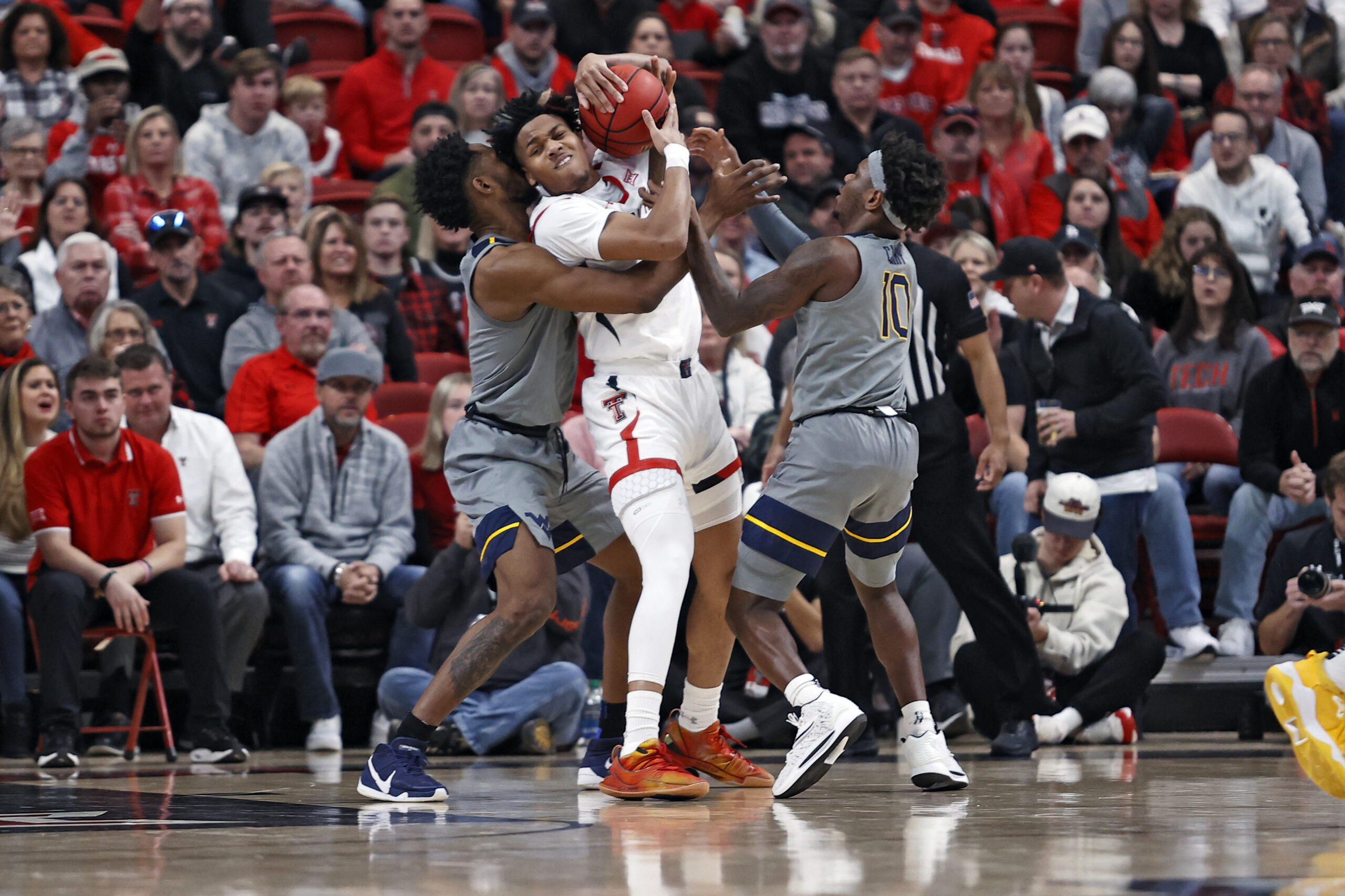 NOTEBOOK: After four guys fouled out, West Virginia not looking to blame refs for loss to No. 18 Texas Tech